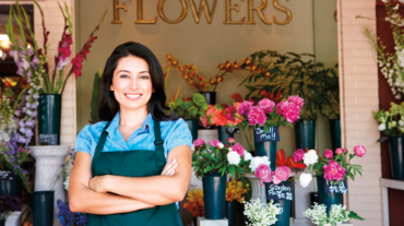 Woman standing outside flower shop